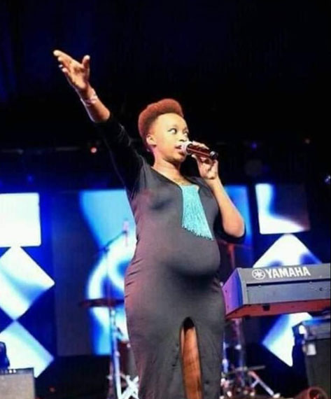 Pregnant Kenyan Pastor Shantelle Jepchumba wearing a dress with a long front slit that revealed her inner thighs and underwear while preaching