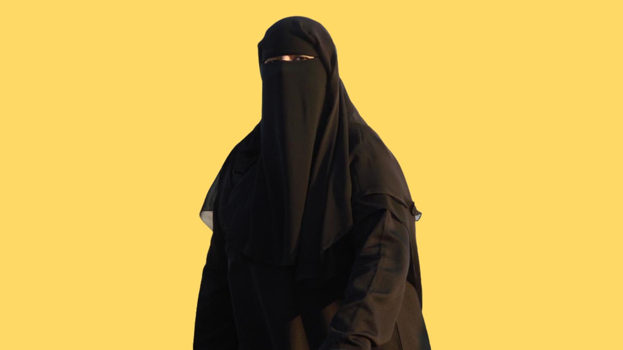an abaya and niqab showing only the eyes of the person wearing them | Betrayal in marriage